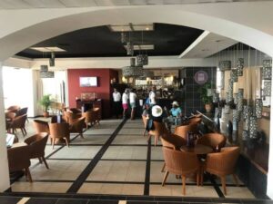 Tables and chairs in the lobby of Hotel Copacabana