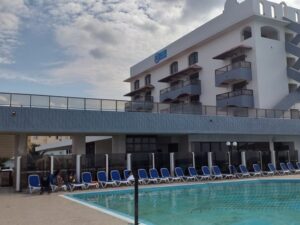 Swimming pool and deck chairs are on the territory of Hotel Copacabana