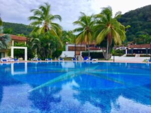 Palms and swimming pool of Jibacoa Hotel