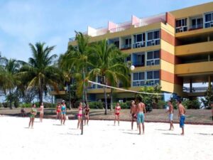 People are playing beach valleyball near Playa Ancon Hotel